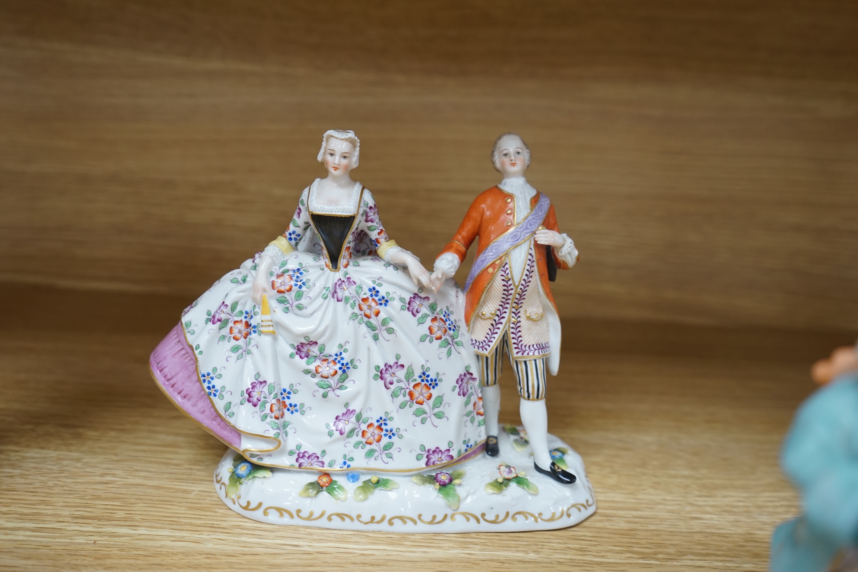 Eight Royal Doulton and 19th century German figures, including two Sitzendorf frog musicians, a Royal Doulton Celia (HN1727) and the toy seller. Condition - fair to good, substantial cracks and damage to the Celia figure